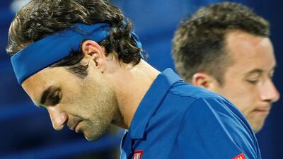 Roger Federer, left, and Philipp Kohlschreiber during a change over. EPA
