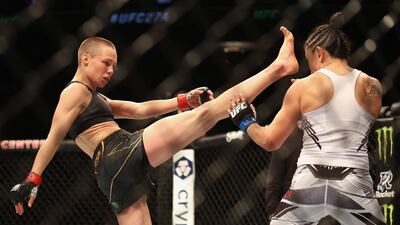 Rose Namajunas kicks Carla Esparza in their women’s strawweight championship bout at UFC 274. Getty