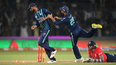 Shan Masood celebrates running out Reece Topley with Haris Rauf. Getty