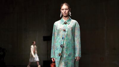 A model presents a creation from British designer Christopher Kane at London Fashion Week. AFP PHOTO / NIKLAS HALLE'N