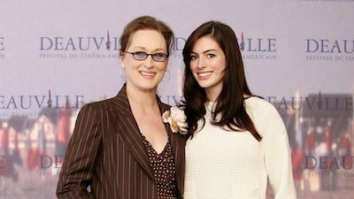Meryl Streep, in pinstripes, and Anne Hathaway attend a photocall for 'The Devil wears Prada' at the 32nd Deauville Festival on September 9, 2006 in Deauville, France. Getty Images