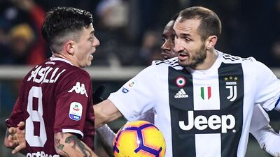 Torino midfielder Daniele Baselli, left, argues with Juventus defender Giorgio Chiellini after Juve opened the scoring. AFP