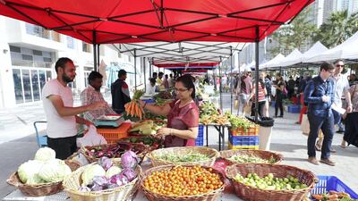Visitors peruse the array of fresh produce on offer at the farmers market in Business Bay. All pictures by Pawan Singh/The National
