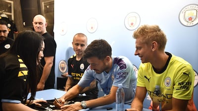 David Silva signs autographs for fans during a promotional event in Hong Kong. AFP