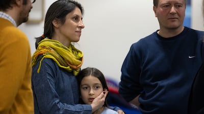 British-Iranian citizen Nazanin Zaghari-Ratcliffe with her daughter Gabriella and husband Richard Ratcliffe after landing at RAF Brize Norton last year. EPA