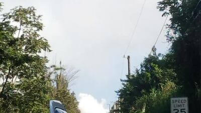 Rising smoke and lava eruption is seen from a road in Leilani, Puna, Hawaii. Reuters
