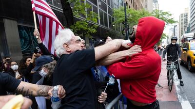 A pro-Palestinian protester scuffles with pro-Israel demonstrators during a rally near the Consulate General of Israel in New York. EPA