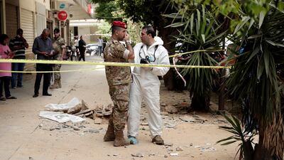 Lebanese Army investigators inspect the area outside a building where clashes erupted between Lebanese troops and a former member of ISIS in Tripoli, Lebanon, Tuesday, June 4, 2019. AP