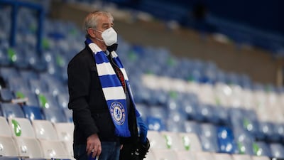 A Chelsea fan wearing a face mask at Stamford Bridge in London, England, ahead of the Premier League match against Leeds United on Saturday. AP