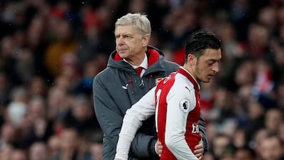 Arsene Wenger, left, refused to sell Mesut Ozil in the summer despite knowing he could walk away for free in 2018. David Klein / Reuters