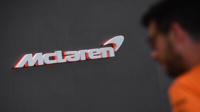 A man walks past the McLaren garage at the Albert Park circuit ahead of the Formula One Australian Grand Prix in Melbourne. AFP
