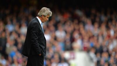Manchester City manager Manuel Pellegrini walks on the touchline during his side's Premier League loss to West Ham United on Saturday in London. Glyn Kirk / AFP