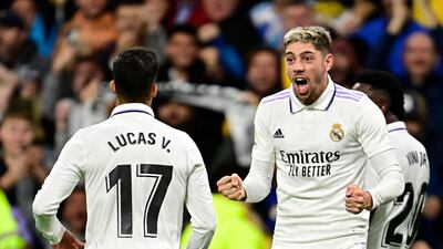 Federico Valverde celebrates with Lucas Vazquez after scoring Real Madrid's third goal. AFP