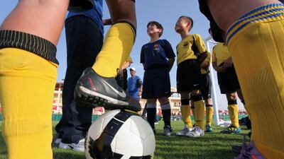 Children shown at one of Barcelona's football academy extensions in Dubai. Randi Sokoloff / The National