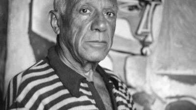 Pablo Picasso with one of his paintings at home in France, where he died in 1973. Getty Images