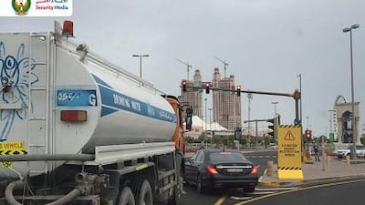 A picture released by the Ministry of Interior’s security media department of a car suddenly pulling out at a junction, cutting off a water truck. Courtesy Security Media