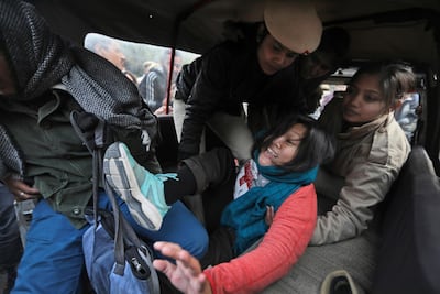 Policewomen detain a student protesting outside Uttar Pradesh. AP