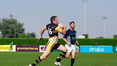 Gulf Legends, in blue, faced J9, in yellow, on Day 2 at the Dubai Rugby Sevens. Victor Besa for The National