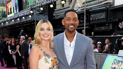 Margot Robbie, in Gucci, and Will Smith attend the 'Suicide Squad' premiere on August 3, 2016 in London, England. Getty Images