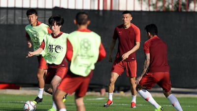 Yu Hanchao of China trains before the start of the Asian Cup at Al Wahda Academy in Abu Dhabi.