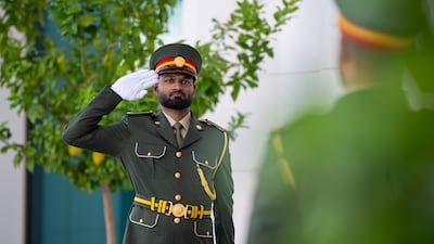 Members of the UAE Armed Forces prepare a guard of honour for Mr Parmelin