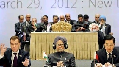 From left, Dmitry Medvedev, the president of Russia, Manmohan Singh, the prime minister of India, and Hu Jintao, the president of China, at the Brics summit in New Delhi, last week. Saurabh Das / AP Photo