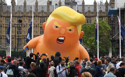 Anti-Trump protesters display a Trump baby blimp over Parliament Square in 2019. EPA