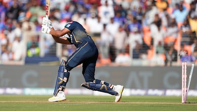 Gujarat Titans' Shahrukh Khan gets bowled out by Royal Challengers Bengaluru's Mohammed Siraj. AP