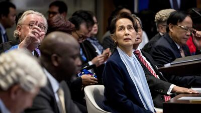 epa08062116 Abubacarr Tambadou (2-L front, seated), minister of justice of The Gambia, and Aung San Suu Kyi (C), Myanmar State Counselor, on the second day before the International Court of Justice (ICJ) in the Peace Palace, The Hague, The Netherlands, 11 December 2019. Myanmar State Counselor Aung San Suu Kyi defended her country at the International Court of Justice against accusations of genocide filed by The Gambia, following the 2017 Myanmar military crackdown on the Rohingya Muslim minority. EPA/KOEN VAN WEEL