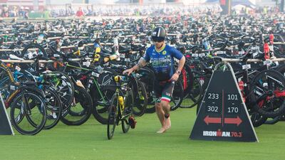 A participants begins the cycling section of the race in Dubai. Leslie Pableo for The National