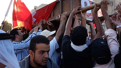 Shiite protesters hold a funeral procession in the village of Aali after a resident was killed in an accident allegedly involving a police car.