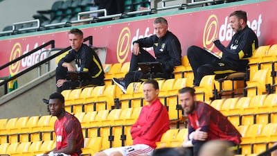 United manager Ole Gunnar Solskjaer, back row centre, sat in the stands. Reuters