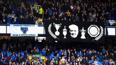 Everton fans display banners prior to kick-off. Stu Forster / Getty Images
