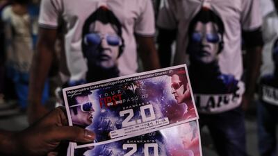 A fan shows tickets to the first day of screening of "2.0." EPA