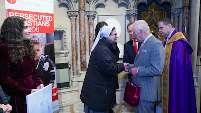 King Charles III meets Sister Annie Demerjian, from Syria, during an advent service celebrating the strength and courage of faith communities at the Catholic Church of the Immaculate Conception, in London in December 2024. PA