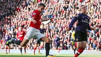 Robin van Persie, left, opens the scoring against Arsenal. Alex Livesey / Getty Images