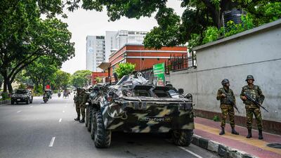 Bangladesh army stand guard near the country's Secretariat as the curfew is relaxed after the anti-quota protests, in Dhaka. AFP