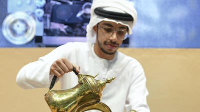 Ahmed Al Shimmari pours out a cup of coffee at the first Gahwa Competition in Abu Dhabi. Khushnum Bhandari for The National