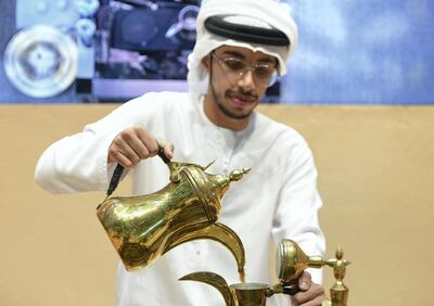 Ahmed Al Shimmari pours out a cup of coffee at the first Gahwa Competition in Abu Dhabi. Khushnum Bhandari for The National