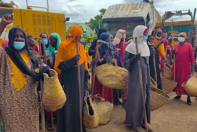 Workers gather to kickstart a hygiene and sanitation campaign in Sudan's eastern city of Gedaref to combat the spread of disease. AFP