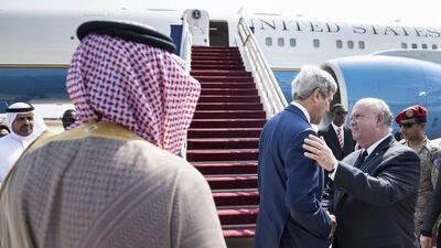 The US secretary of state John Kerry, centre, with Joseph W Westphal, the US Ambassador to Saudi Arabia. Mr Kerry's visit was aimed at pinning down how much support regional allies are willing to give to the US plan to beat back ISIL. Brendan Smialowski / AP Photo