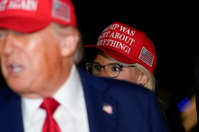 US Representative Ashley Hinson looks on as President Donald Trump speaks at Joint Base Andrews, Maryland. Reuters
