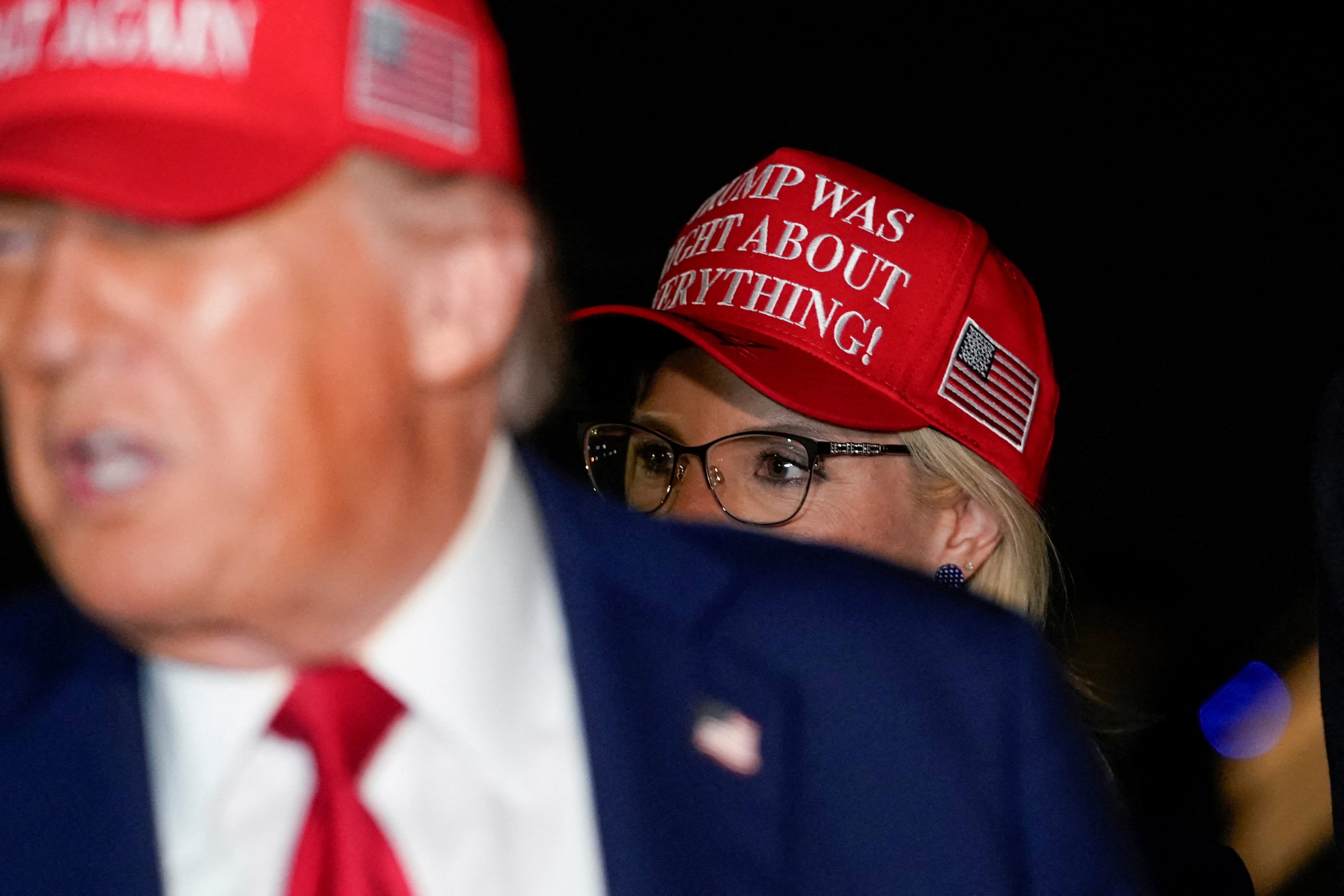 US Representative Ashley Hinson looks on as President Donald Trump speaks at Joint Base Andrews, Maryland. Reuters