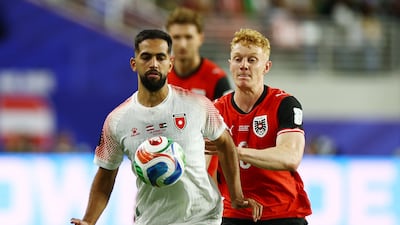 Jordan's Ali Olwan in action with Austria's Nicolas Seiwald. Reuters