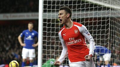 Arsenal's Laurent Koscielny celebrates scoring his side's first goal during their 2-1 Premier League win over Leicester City on Tuesday at the Emirates Stadium. Matt Dunham / AP
