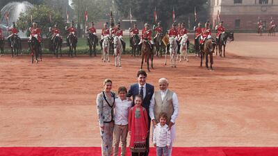 Mr Trudeau, his wife, their daughter, Ella Grace, and their sons, Xavier and Hadrien, pose for photographers with Mr Modi during the ceremonial reception for the Canadian prime minister. Adnan Abidi / Reuters