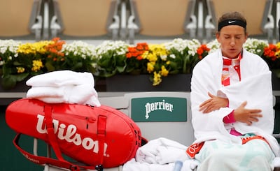 Victoria Azarenka wraps up warm during her French Open first round match against Danka Kovinic. Reuters