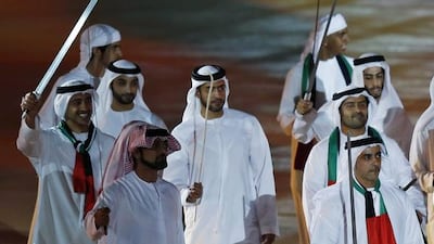 Sheikh Abdullah bin Zayed, the Minister of Foreign Affairs, left, and Lt General Sheikh Saif bin Zayed, Deputy Prime Minister and Minister of Interior, perform a traditional dance at the Zayed Sports Stadium. EPA /Ali Haider