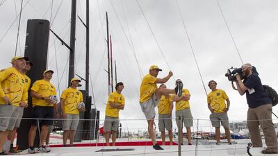 New Zealand rugby star Dan Carter kicks into the air aboard Azzam as the Abu Dhabi Ocean Racing crew look on in Auckland, New Zealand. Photo Courtesy / Ian Roman / Abu Dhabi Ocean Racing