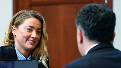 Heard speaks with her lawyer in the courtroom. Pool Photo via AP